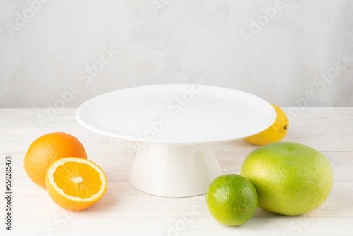 Empty white plate with fruits © Jakub