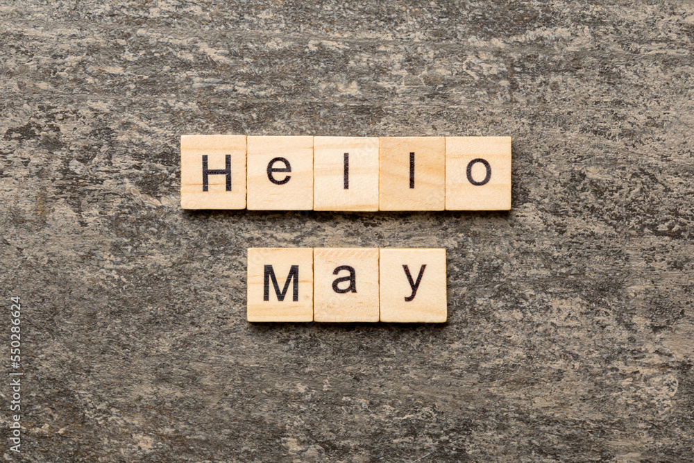 Fototapeta premium hello May word written on wood block. hello May text on table, concept