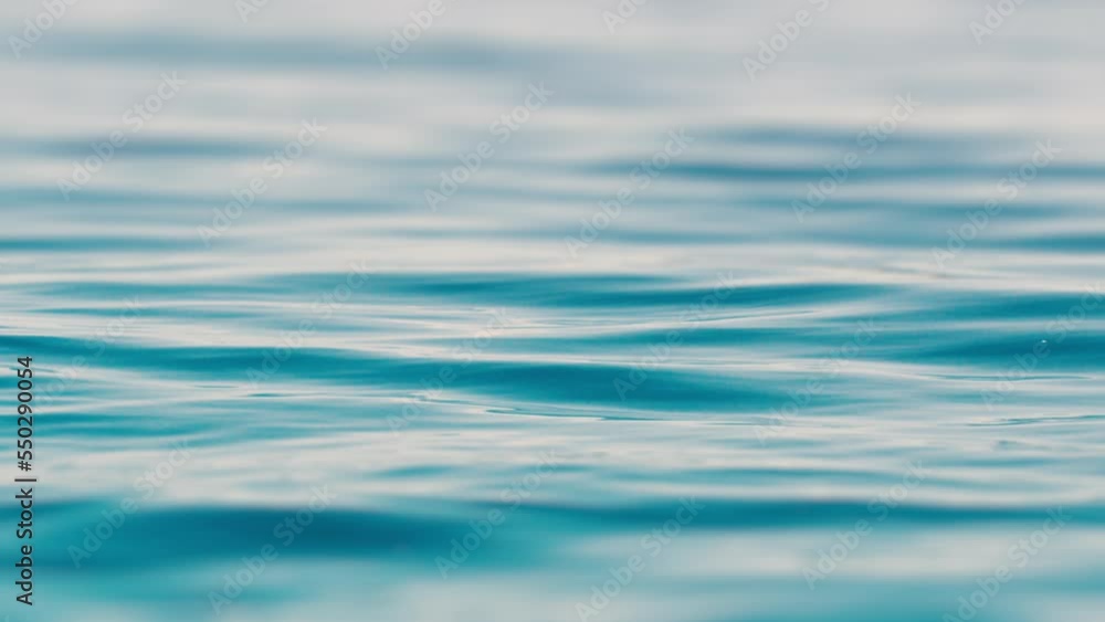 Calm sea surface with gentle waves and ripples Calm sea surface with gentle waves and ripples