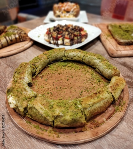 Traditional Turkish, Arabic dessert baklava assortment with pistachio. Ramadan sweets.  photo