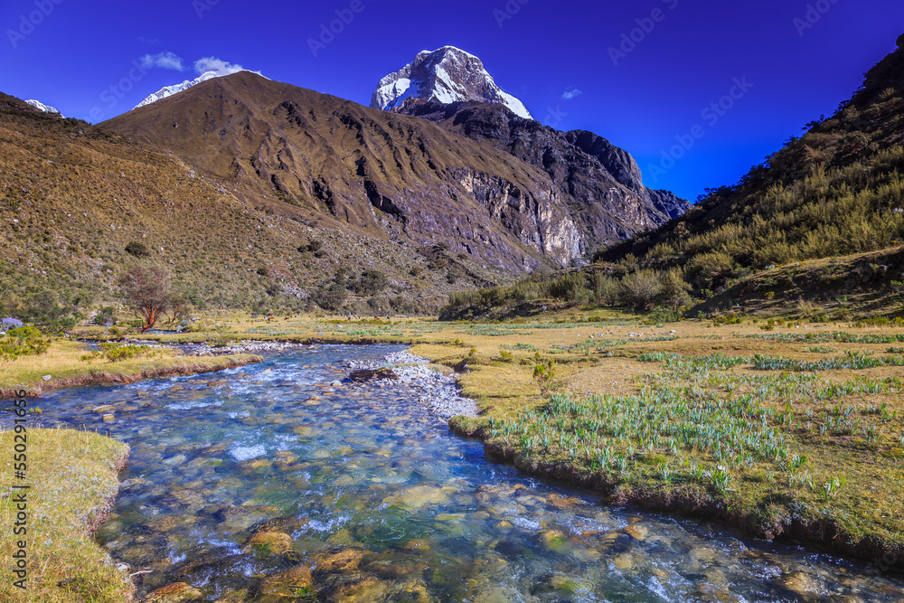 River and Huascaran massif in Cordillera Blanca, snowcapped Andes, Ancash, Peru
