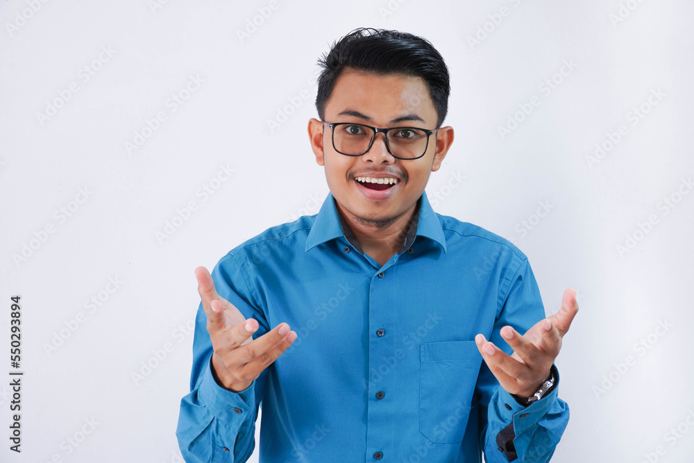 excited handsome young asian businessman with glasses in wearing blue shirt celebrating success isolated on white background