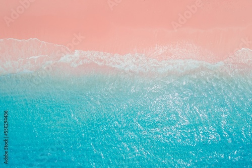 Tropical pink beach with crystal blue ocean. Aerial view of holidays beach on Komodo islands © artifirsov