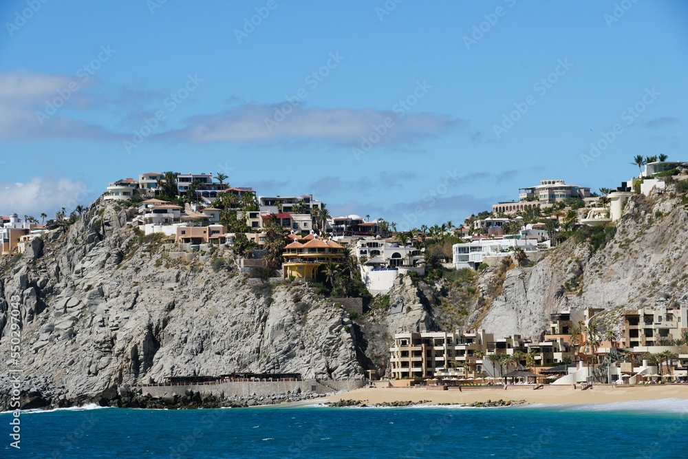 The hill with luxury waterfront homes and resort hotels by the bay near Cabo San Lucas, Mexico