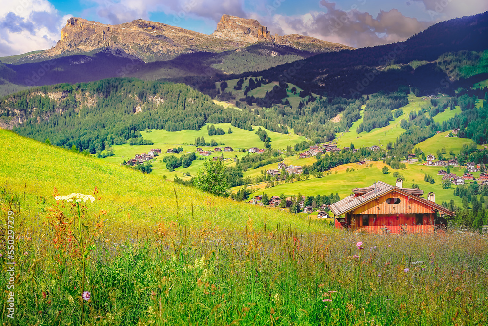 Langkofel and alpine village, Dolomites sudtirol near Cortina d Ampezzo Langkofel and alpine village, Dolomites sudtirol near Cortina d Ampezzo