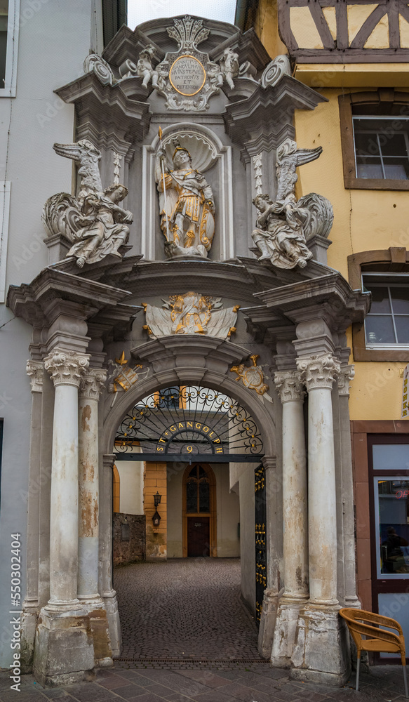 Nice close-up view of the baroque entrance gate of the St. Gangolf's Church in Trier, Germany. The gate of the Roman Catholic church was created by the Augustinian Josef Walter in 1731-32.