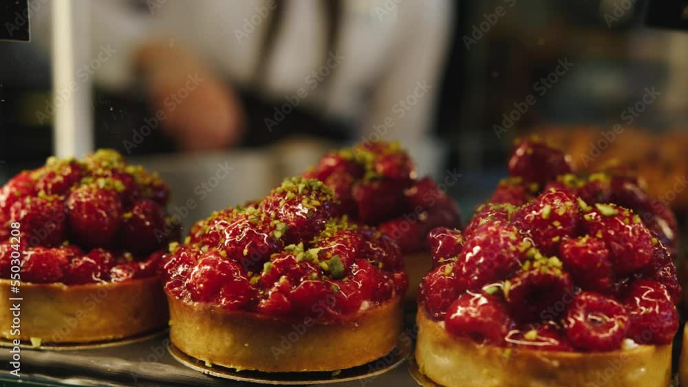 A lot of berry cakes in close-up on the window. A lot of berry cakes in close-up on the window.