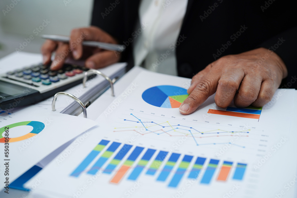 Business woman working and analysis with statistic graph in office. Business woman working and analysis with statistic graph in office.