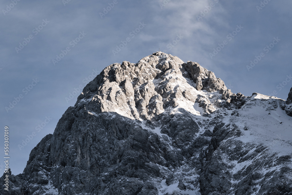 snow covered mountains with blue sky, sun light and clouds - Zugspitze, Alps