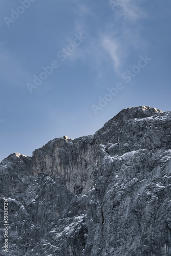snow covered mountains with blue sky, sun light and clouds - Zugspitze, Alps