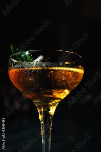 Photography Vertical shot of a stinger cocktail with a dark background