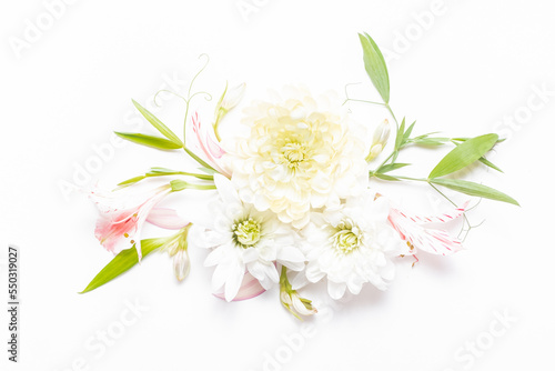 Delicate flower arrangement with flowers and leaves. Summer festive background. Copy space, flat lay.