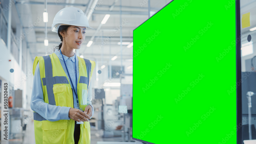Factory Office Meeting: Senior Engineer Talking in a Conference Room with TV with Green Screen Mock Up Display. Concept for Heavy Industry and Manufacturing Related Templates. Factory Office Meeting: Senior Engineer Talking in a Conference Room with TV with Green Screen Mock Up Display. Concept for Heavy Industry and Manufacturing Related Templates.
