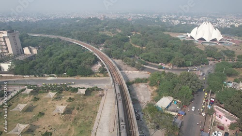 Aerial Drone shot of Delhi metro train and Lotus Temple Kalkaji Metro Station in New Delhi India photo