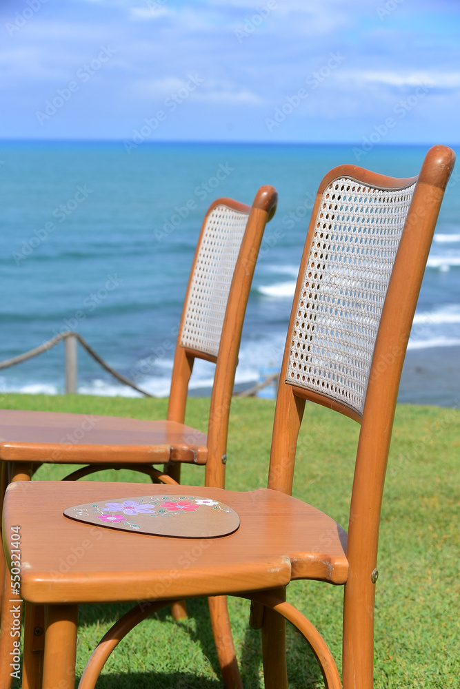 wooden chair on the beach, horizon line, chairs in the garden facing the sea, wooden chairs with straw, rattan, wooden chair on the beach, horizon line, chairs in the garden facing the sea, wooden chairs with straw, rattan,
