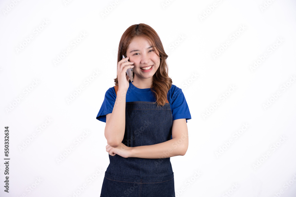 Young Asian woman cafe owner feeling happy using cellphone to advertise through social media or manage electronic banking, isolate with white background, small business owner, young confident woman. Young Asian woman cafe owner feeling happy using cellphone to advertise through social media or manage electronic banking, isolate with white background, small business owner, young confident woman.