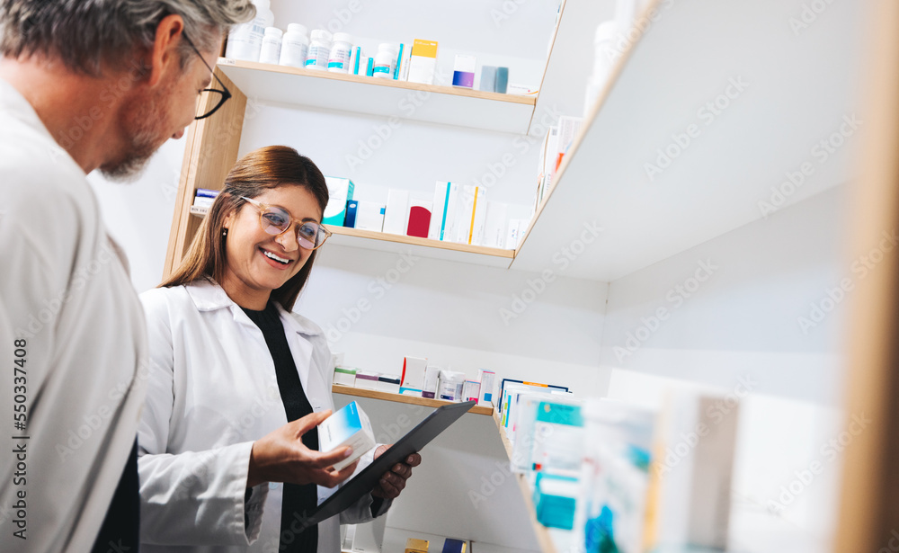 Pharmacists picking prescription medication in a chemist Pharmacists picking prescription medication in a chemist