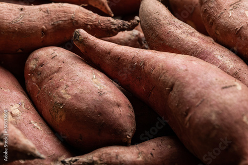 Pile of uncooked sweet potato