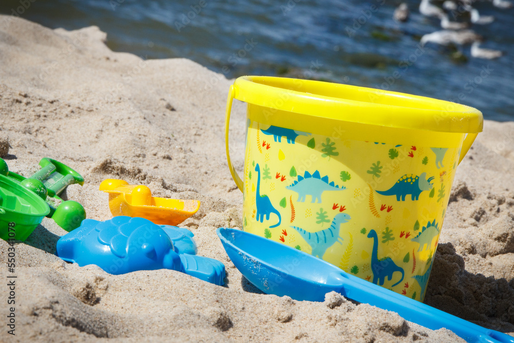 Children toys for relax or playing on sand at beach. Vacation time Children toys for relax or playing on sand at beach. Vacation time