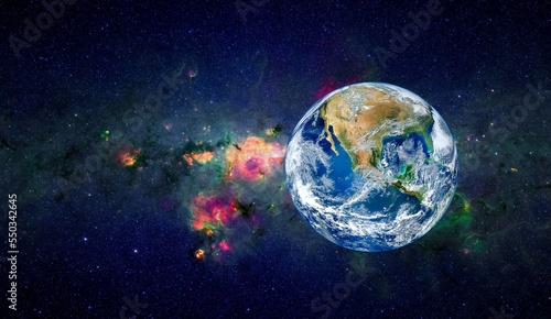 Fototapeta Naklejka Na Ścianę i Meble -  Planet Earth in the space. Millions of stars in the background. Space, sci-fi background photo with copy space for text. Elements of this image furnished by NASA.