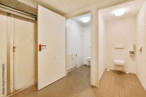 Wall hung toilet in narrow lavatory