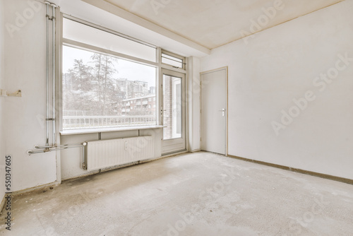 Empty room with window and radiator
