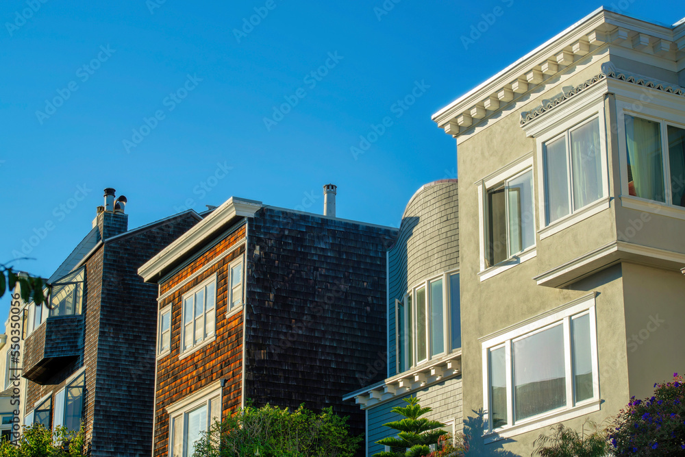 Row of decorative house facades in the historic districts of downtown san francisco california with stucco and wood exteriors