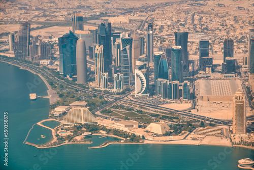 Aerial view of Doha skyline from airplane. Corniche and modern buildings  Qatar