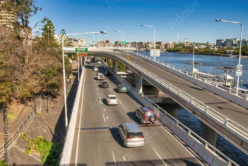 City traffic along Brisbane River on a major city road