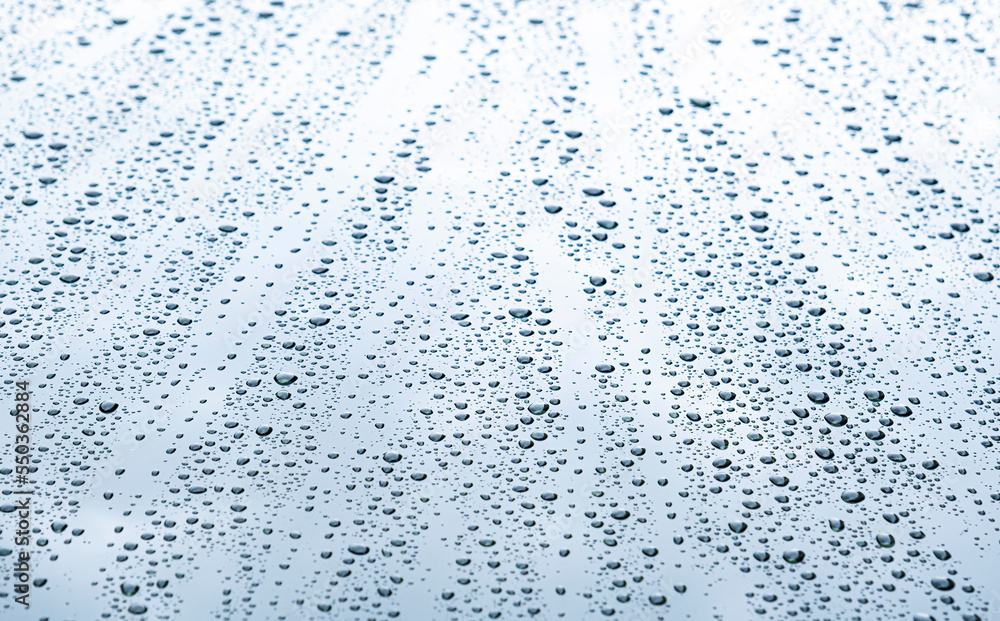 Close up rain drop on surface of car's body after passed from rainy area Close up rain drop on surface of car's body after passed from rainy area