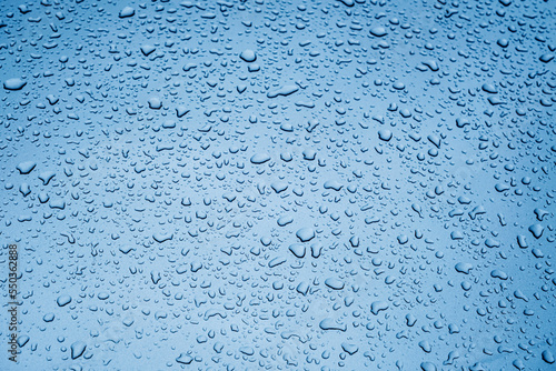 Close up rain drop on surface of car's body after passed from rainy area