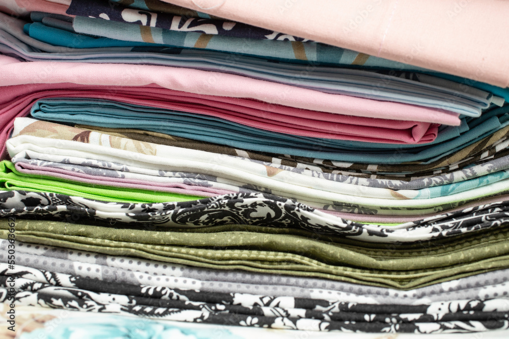 many colored fabric folds stacked. many colored fabric folds stacked.