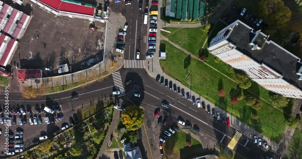 accelerated video 4x aerial view above at crossroads on road junction with heavy traffic with parking accelerated video 4x aerial view above at crossroads on road junction with heavy traffic with parking