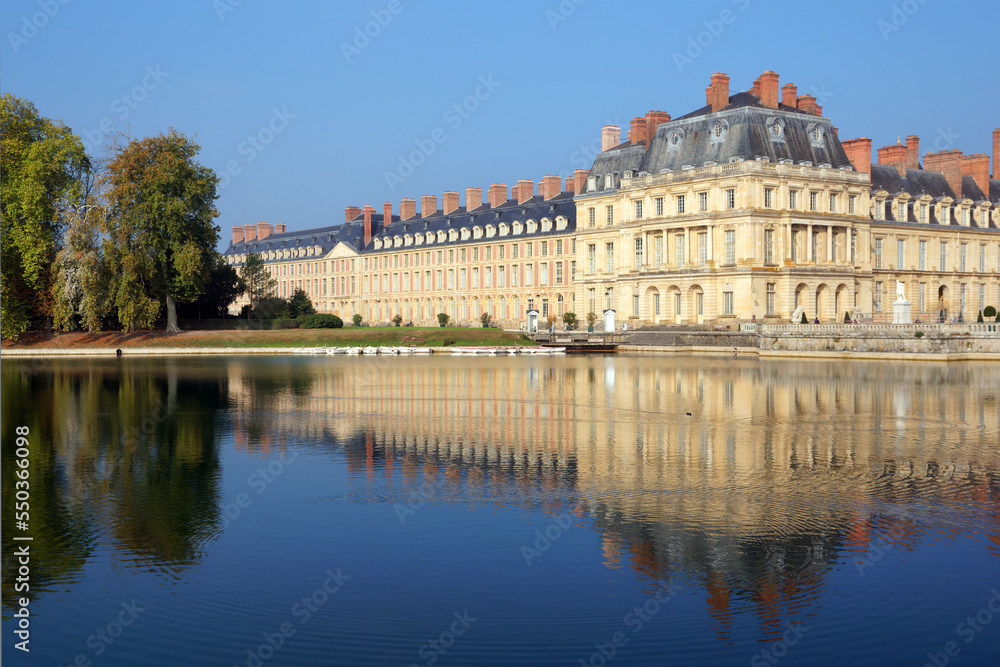 Fontainebleau castle and carp pond in Île-De-France region