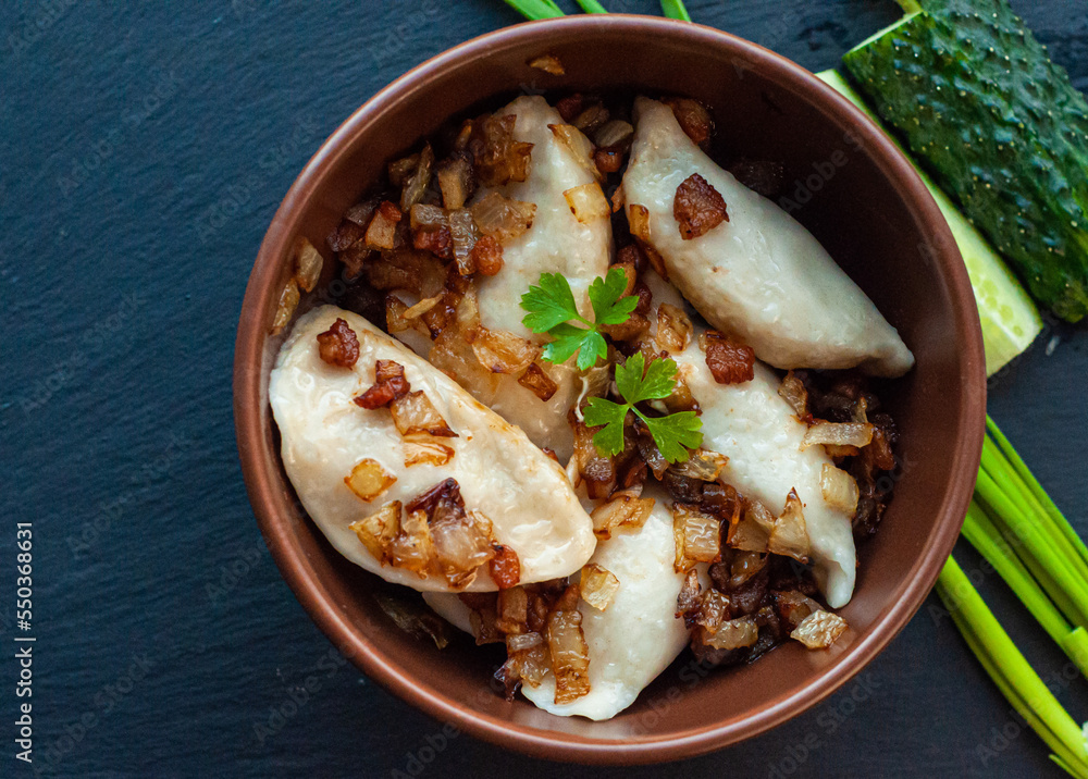national Ukrainian dish, traditional varenyki with potatoes, cabbage, crackers made of lard and fried onions, food of the countries of the world, gastrotourism, culture of Ukraine national Ukrainian dish, traditional varenyki with potatoes, cabbage, crackers made of lard and fried onions, food of the countries of the world, gastrotourism, culture of Ukraine