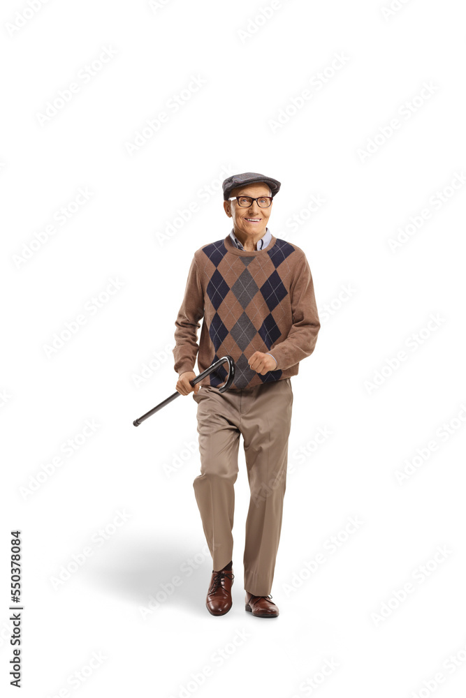 Obraz premium Happy elderly man walking and holding a cane