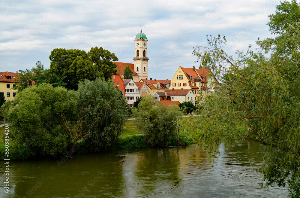 a scenic view of the ancient Bavarian Regensburg city with its beautiful Saint Emmeram's Abbey and ancient houses on a spring day (Bavaria, Germany)
