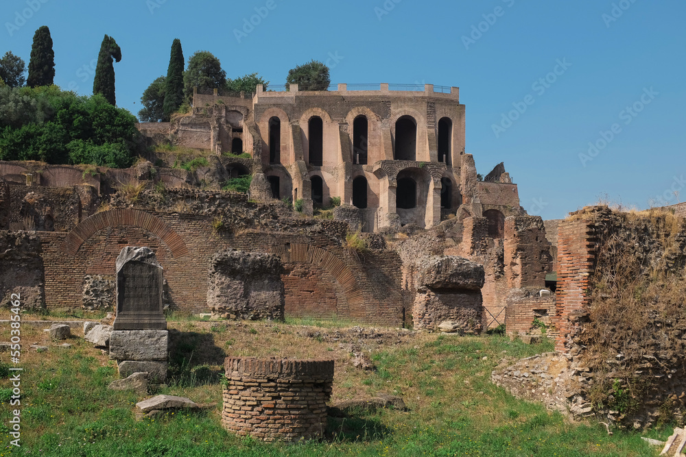 Rome, Italy - day view of ancient ruins inside Palatine Hill, the first nucleus of the Roman Empire. Famous landmark. Tourist attraction horizontal background.