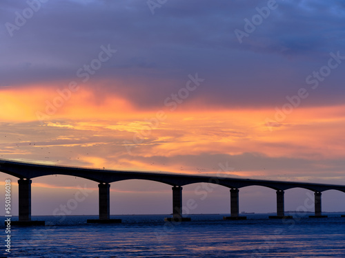 Sunset over the Herbert C Bonner new bridge spanning the Oregon Inlet on the Outer Banks of North Carolina