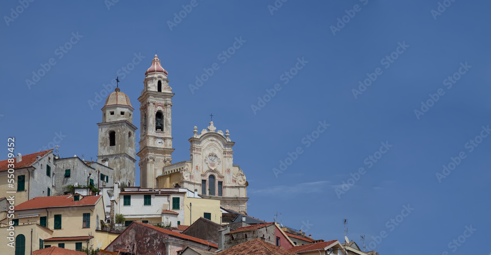 San Giovanni Battista on a hill around the brick roofs of houses against a blue sky