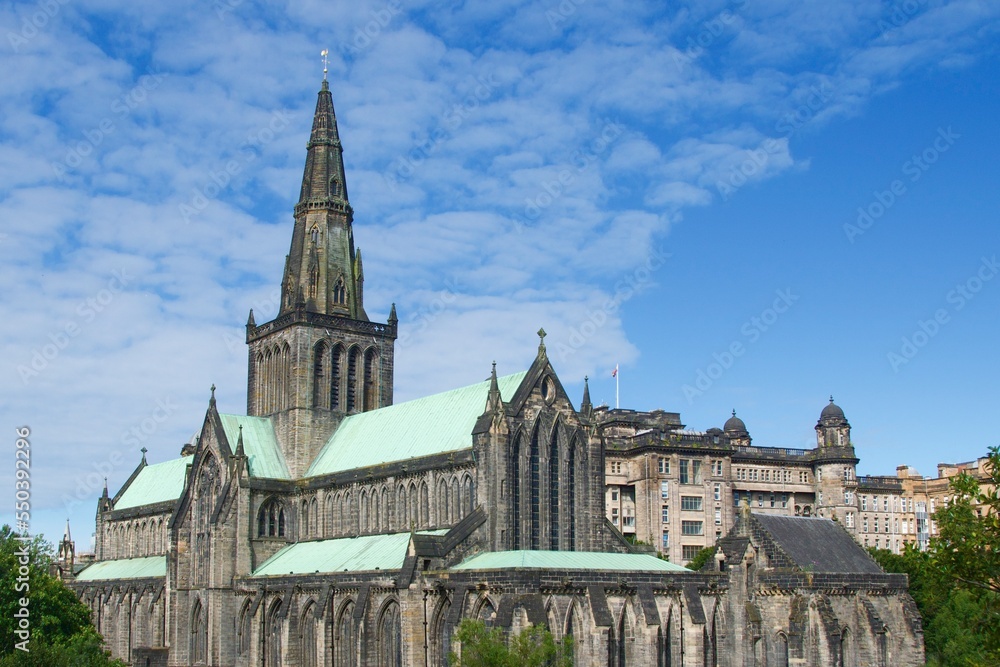 Majestic Glasgow Cathedral with green roof against the blue sky in Scotland Majestic Glasgow Cathedral with green roof against the blue sky in Scotland