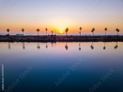 Carlsbad California - Peaceful Sunset with Palm Trees Reflected in Calm Ocean Water – Tropical Beach Landscape