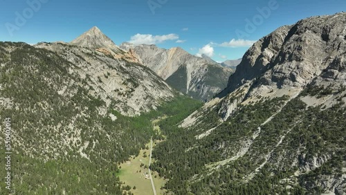 high altitude view valley covered with forest rocky mountains frenc alps sunny day  photo