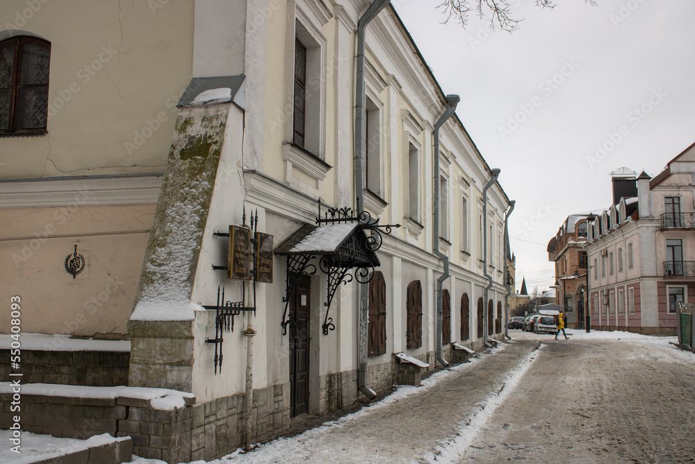 Family house museum of Kosachey in Lutsk Ukraine. Winter view on architecture old town stone street and history building. Literary memorial of poetess lesya Ukrainka. Tourist famous attraction.