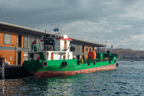 Fotografija Green wherry near the pier.