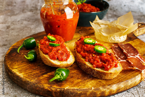 Slices of fresh bread spread with homemade lutenica