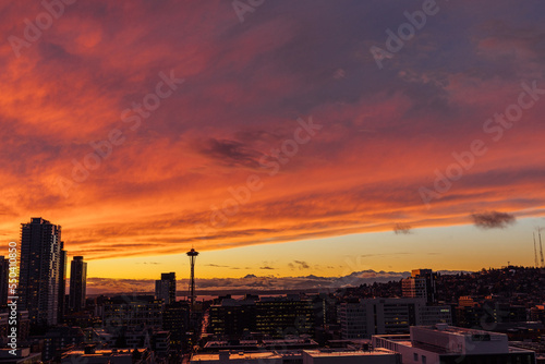 dramatic red, orange, yellow winter sunset over the city of Seattle