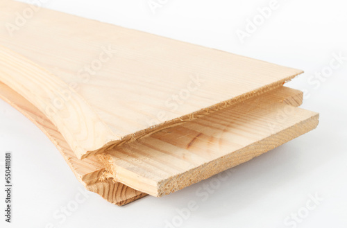 a fragment of a wooden blank for the assembly of paneled doors, after processing by a milling machine, close-up on an isolated white background
