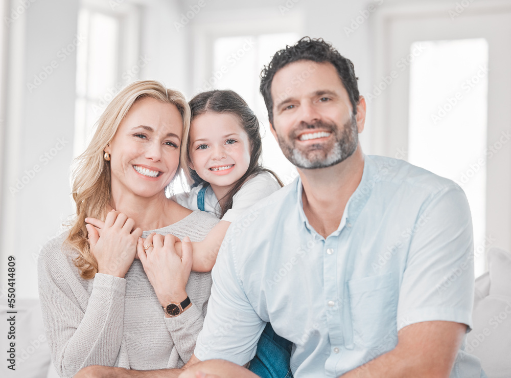 Family, love and relax on sofa together for quality time or relationship bonding in family home. Happy family portrait, parents support and relaxing hug with smiling young child on couch at home Family, love and relax on sofa together for quality time or relationship bonding in family home. Happy family portrait, parents support and relaxing hug with smiling young child on couch at home