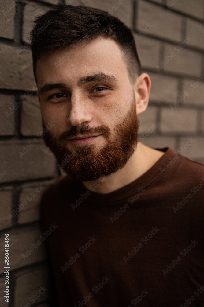 Obraz premium Young handsome man with a red beard, portrait, close-up.